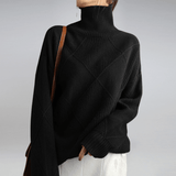 Women's Ribbed Oversized Panelled Turtleneck Sweater in Black, on model